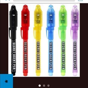 Two packages of six invisible spy pens with UV light - total 10